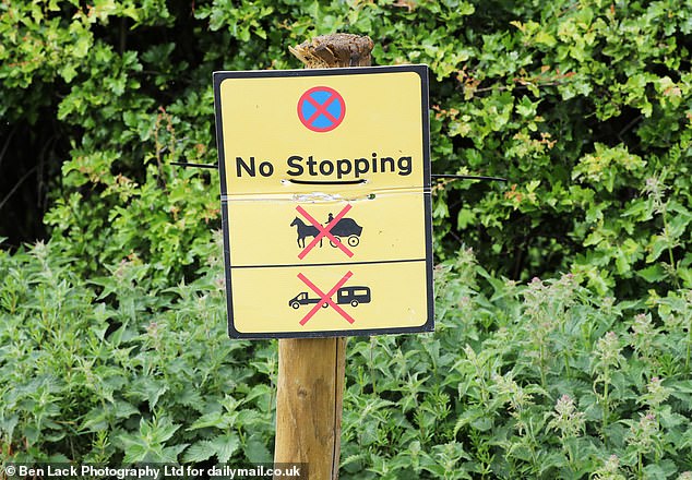 Staves have been hammered deep into roadside verges with signs on making it clear that horses and caravans are not to park there