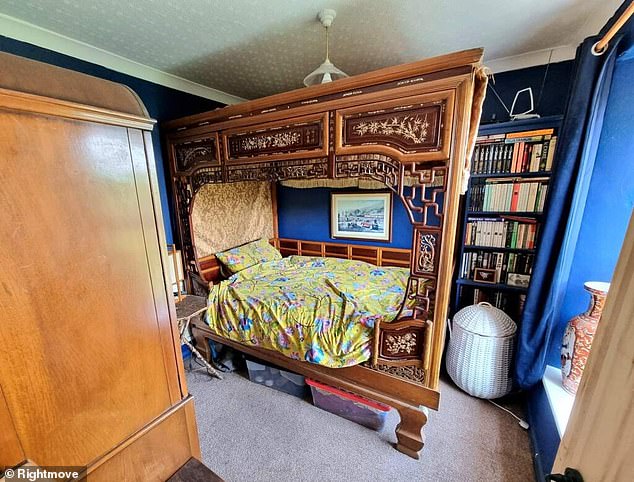 One bedroom, however, features an unusual wooden four-poster frame