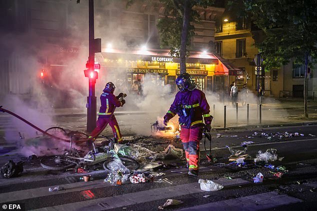 French firefighters extinguished street fires that had cropped up around the capital as police and PSG ultras continued to clash throughout the night