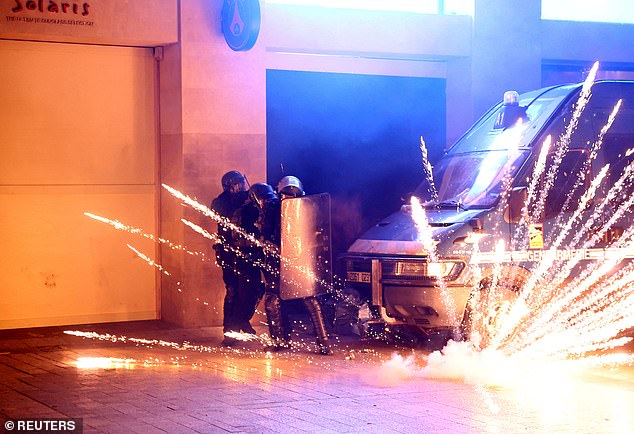 Cars were set on fire around the Porte de Saint-Cloud – a major traffic intersection, where rocket fireworks were fired at police