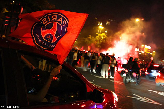Paris St Germain fans drove through the French capital waving flags as riot police attempted to disperse crowds