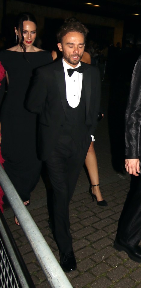 Jack P. Shepherd and a woman in black formal wear at an awards ceremony.