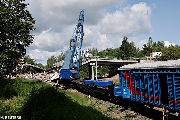 An evacuation train is seen at the scene, after a road bridge collapsed onto railway tracks derailing an approaching passenger train in the Bryansk region, Russia, June 1, 2025