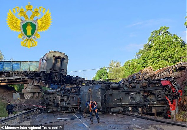 Russian law enforcement officers working at the site of a rail bridge collapse in the Kursk region