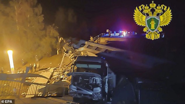 Russian rescuers working at the site after a bridge collapsed on a passenger train in the Vygonichsky district, Bryansk region, Russia, June 1, 2025