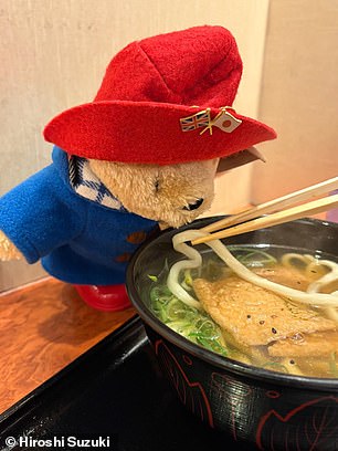 Adorned with a pin of the Japanese and English flags, Paddington has been exploring Japan while Hiroshi and his wife have visited