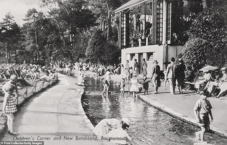 Children are photographed as they play in the Children's Garden at the Pleasure Gardens in Bournemouth in the 1920s. Like many seaside towns, Bournemouth had large gardens for tourists to enjoy as well as the beach