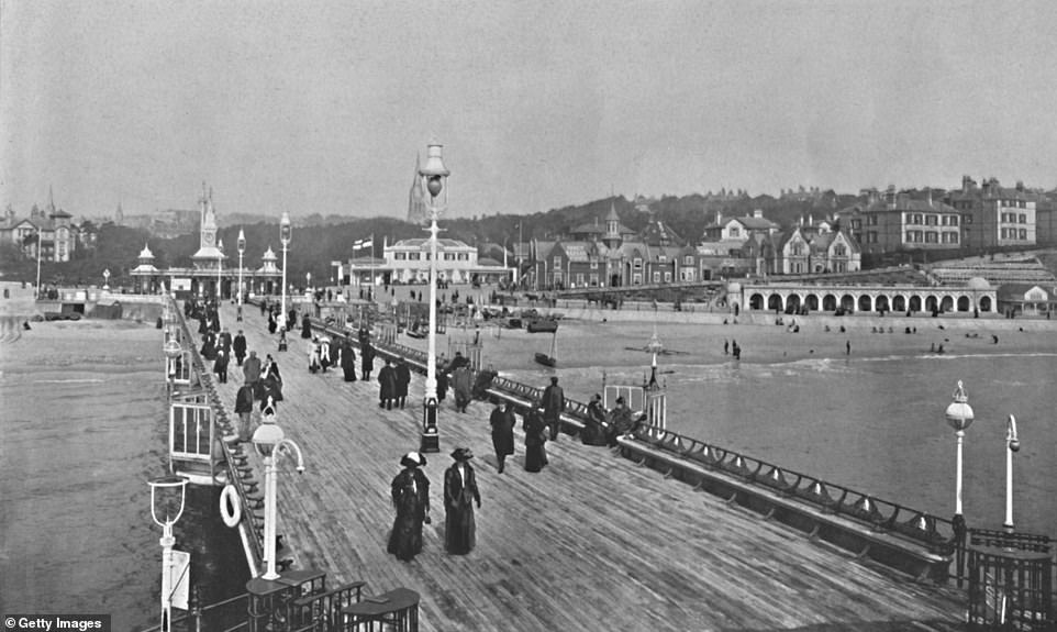 Bournemouth Pier is seen here in around 1910. The pier was opened in 1880 and cost £21,600 to build. According to Bournemouth Pier, the pier was the 'place to be see and been seen in your best clothes'