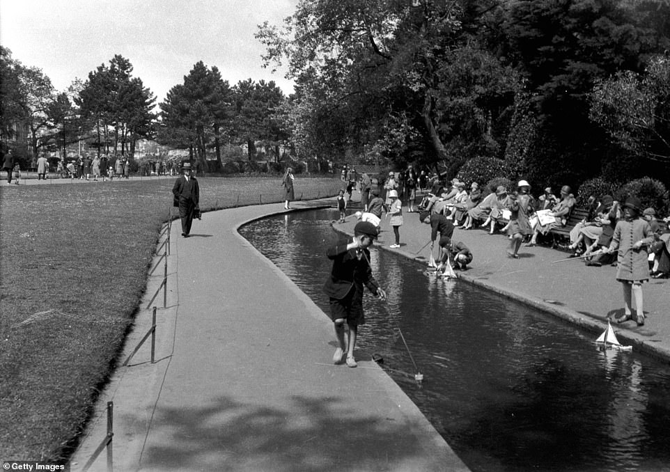 Children are pictured playing by the water in one of Bournemouth's parks in around 1930. Visit Bournemouth explains that the city grew in the early 20th century with many new theatres, cafes and hotels opening to cater to holidaymakers