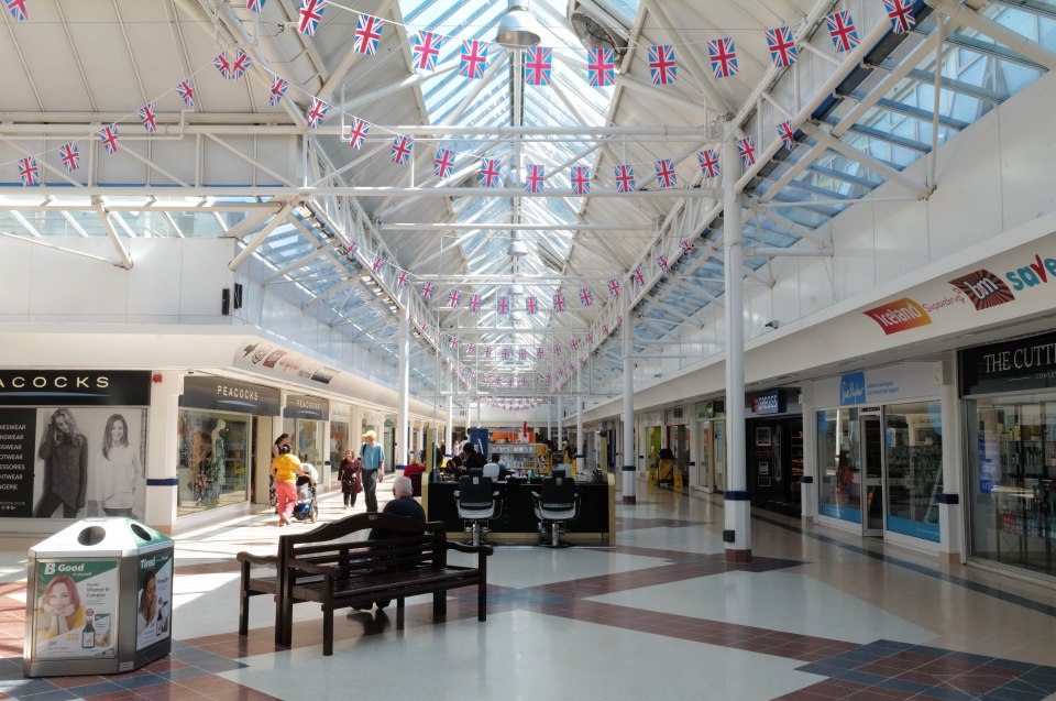 Interior of Templars Square Shopping Centre in Oxford, decorated with Union Jack flags.