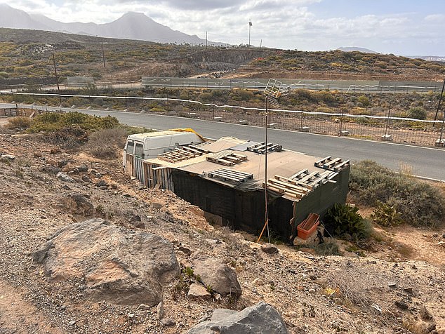 In the shadow of the five-star resort are hundreds of people living in makeshift homes, some of them just metres from the developer's diggers