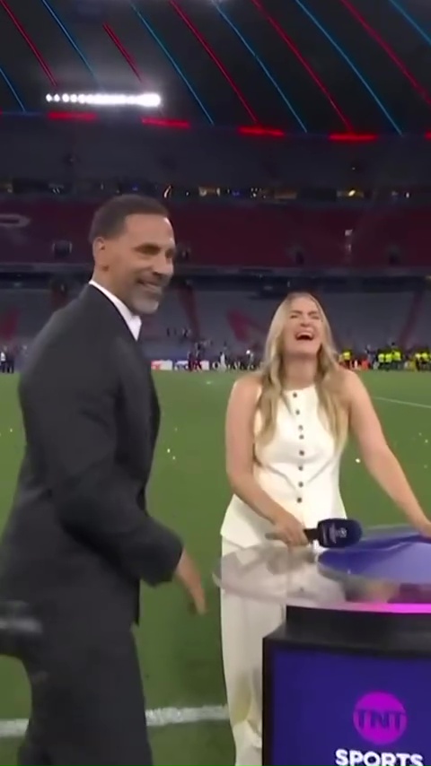 Rio Ferdinand and Laura Woods laughing at a sports event.
