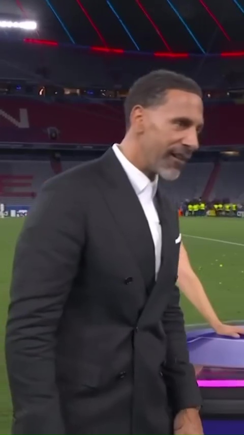 Rio Ferdinand at a soccer stadium.
