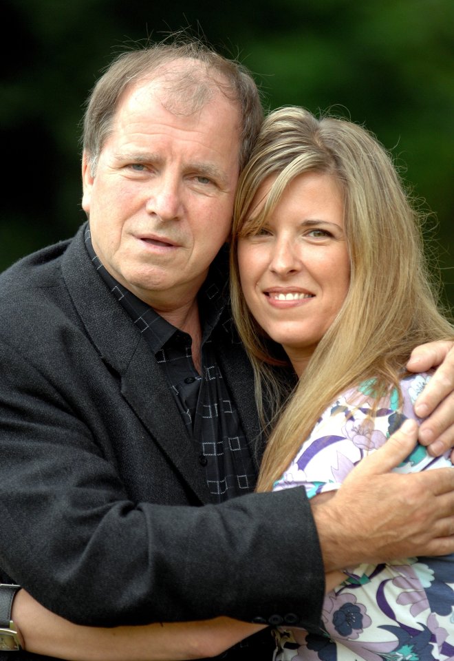 A father and daughter embracing.