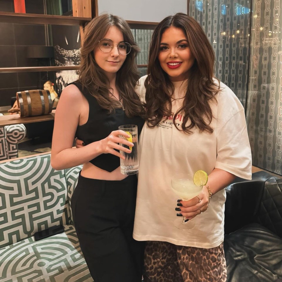 Two sisters celebrating a birthday with cocktails.