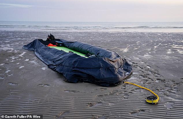 The remains of a small boat on the beach in Gravelines, France, following an unsuccessful attempt by people thought to be migrants to reach the UK