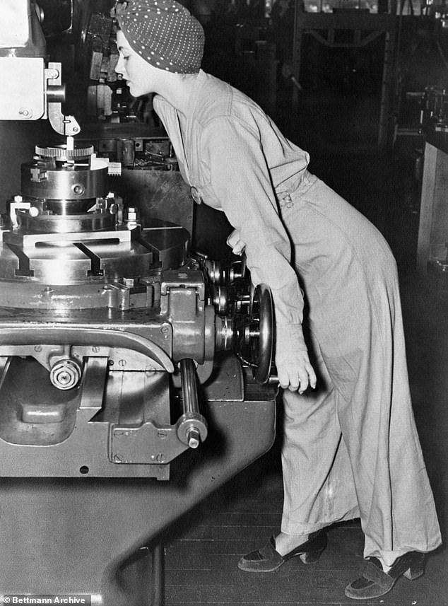 Naomi Parker, an American war worker, is seen working on the aircraft assembly at the Naval Air Station