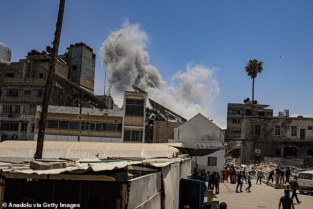 Smoke rises after an Israeli attack hit a house of Palestinian family near al Ahly Hospital in Gaza City, Gaza on May 31, 2025