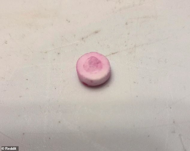 Alongside his post, the father shared two photos of the grinning, unexpected laundry intruder - one showing its face head-on, and another flipped upside down to reveal a lighter pink underside (pictured)