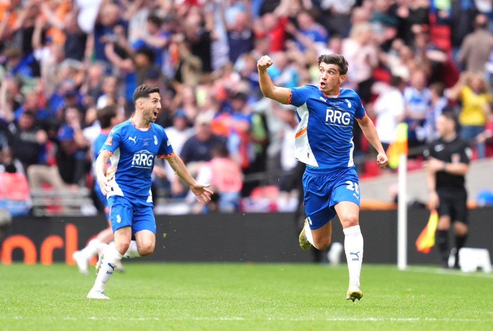 Soccer player celebrating a goal.