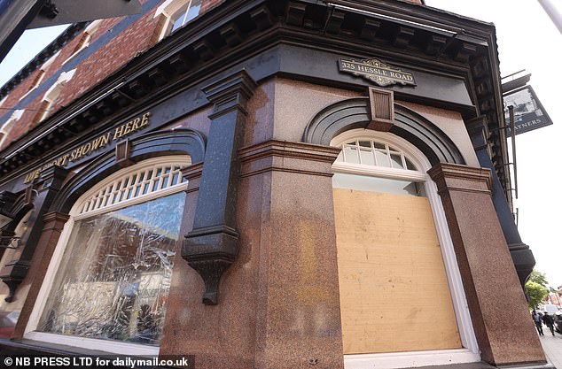 At Rayners pub (pictured), once a favourite haunt of returning fishermen, the large windows are now covered in sheets of cellophane, having been smashed not for the first time