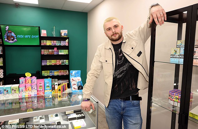Jake Casprzak, 21, (pictured) recently opened the Kasa vape shop, proudly displaying his merchandise. He was quickly forced to hide them behind lock and key after children as young as 13 began stealing from his displays