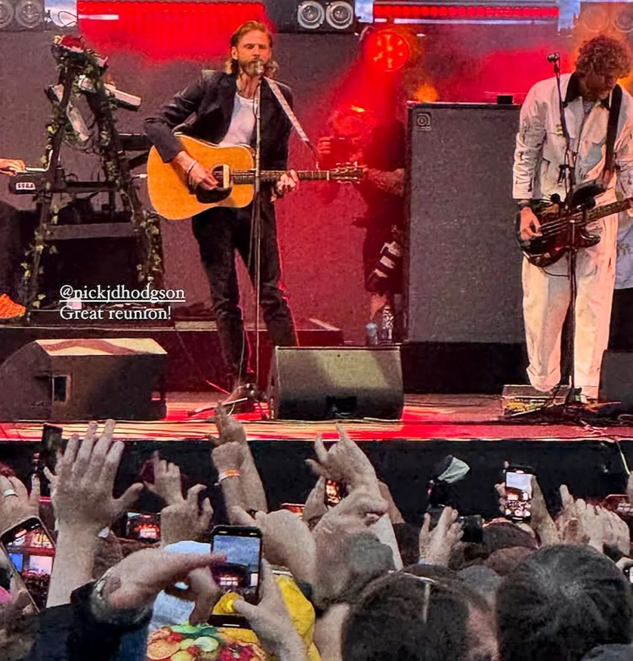 Nick Hodgson performing with Kaiser Chiefs at a concert.