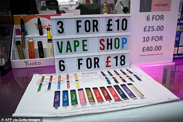 A photograph taken on April 10, 2024 shows a stand selling vapes also called electronic cigarettes or e-cigarettes in a shop in Liverpool