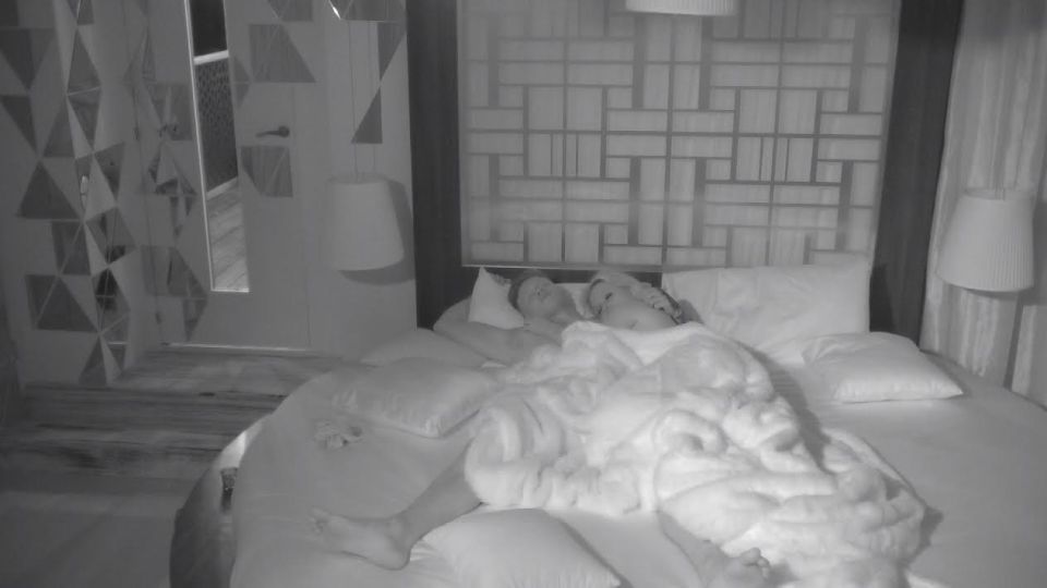 Zara Holland and Alex Bowen asleep in bed.