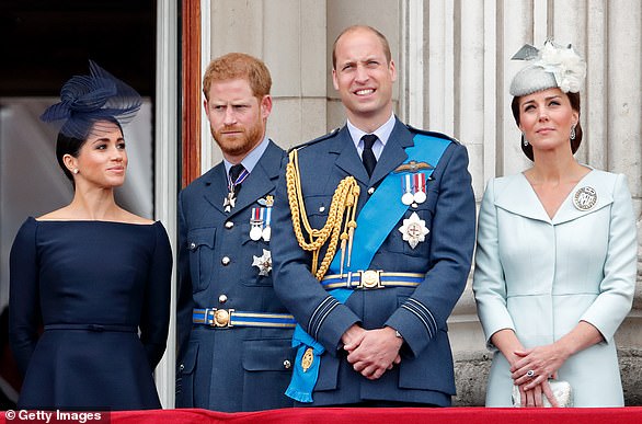 Meghan, Harry, William and Kate watch a flypast to mark the centenary of the Royal Air Force from the balcony of Buckingham Palace on July 10, 2018