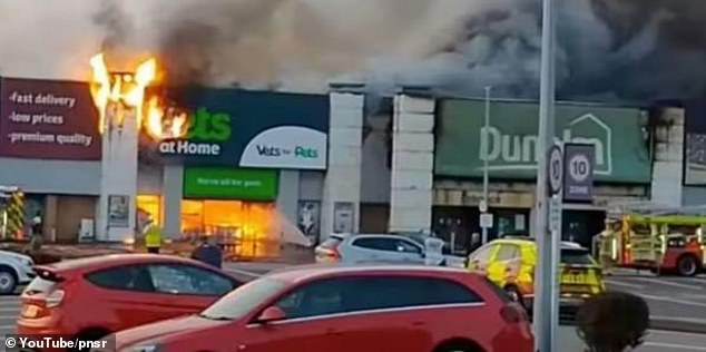 Dramatic pictures show the towering inferno which then spread to neighbouring Pets at Home after the suspected arson attack