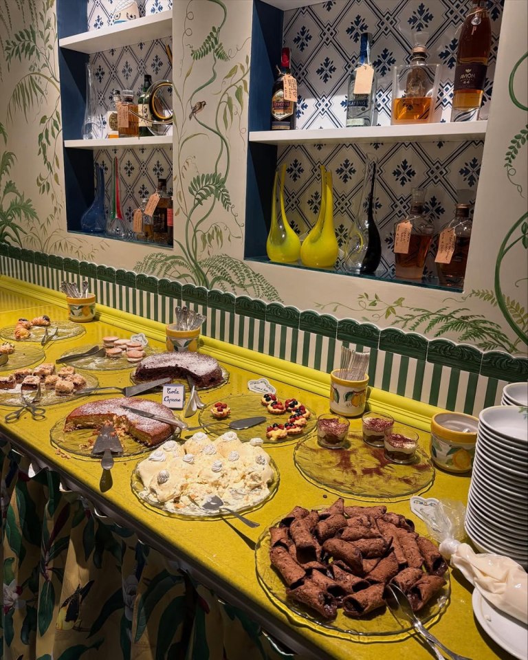 Dessert buffet with various pastries and cakes.