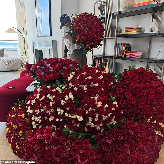 The rapper also included a clip with a lavish display of red roses, with multiple, massive bouquets in her room as well as another snapshot of herself holding even more roses at a different time