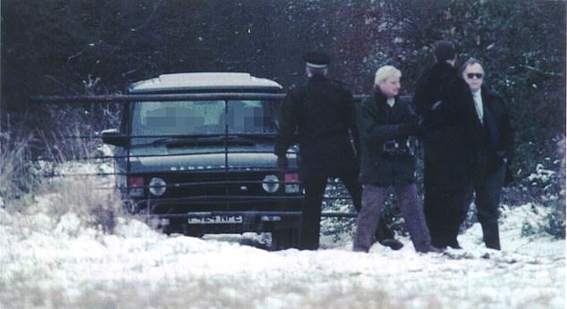 The 4x4 was discovered on a farm track in Rettendon, near Chelmsford in Essex (pictured: police at the scene)