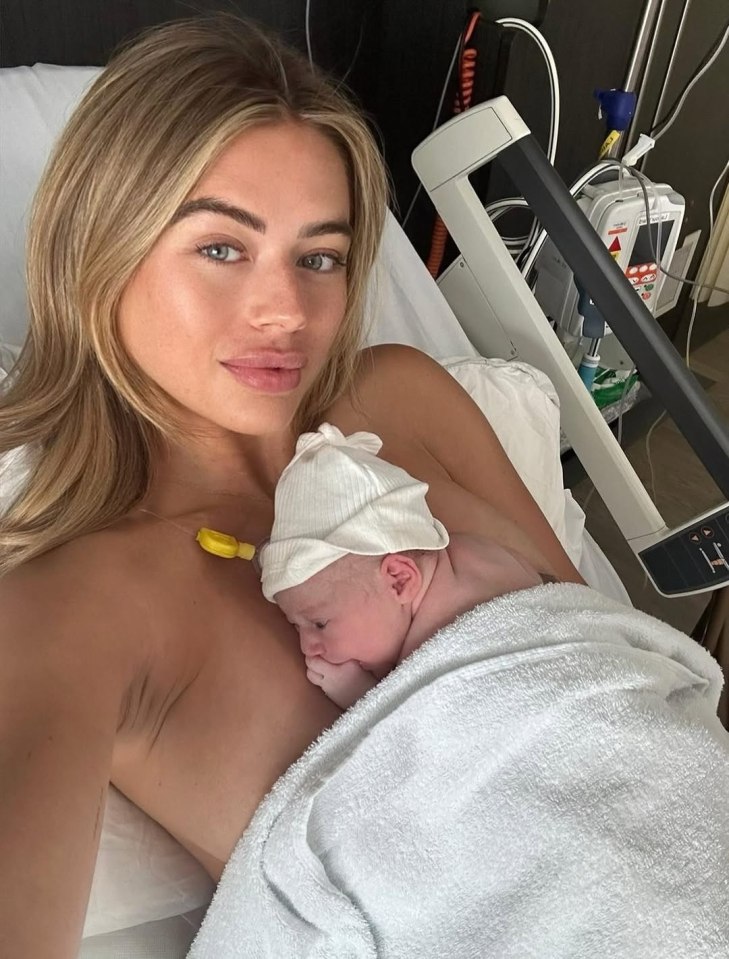 Arabella Chi holding her newborn baby.