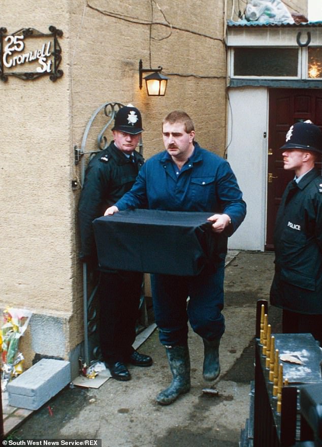 Pictured: Police removing evidence from the property on Cromwell Street