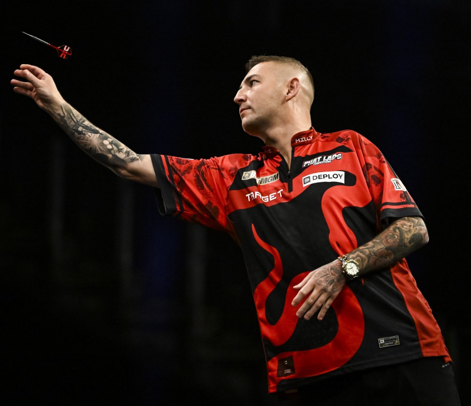 Nathan Aspinall throwing a dart.