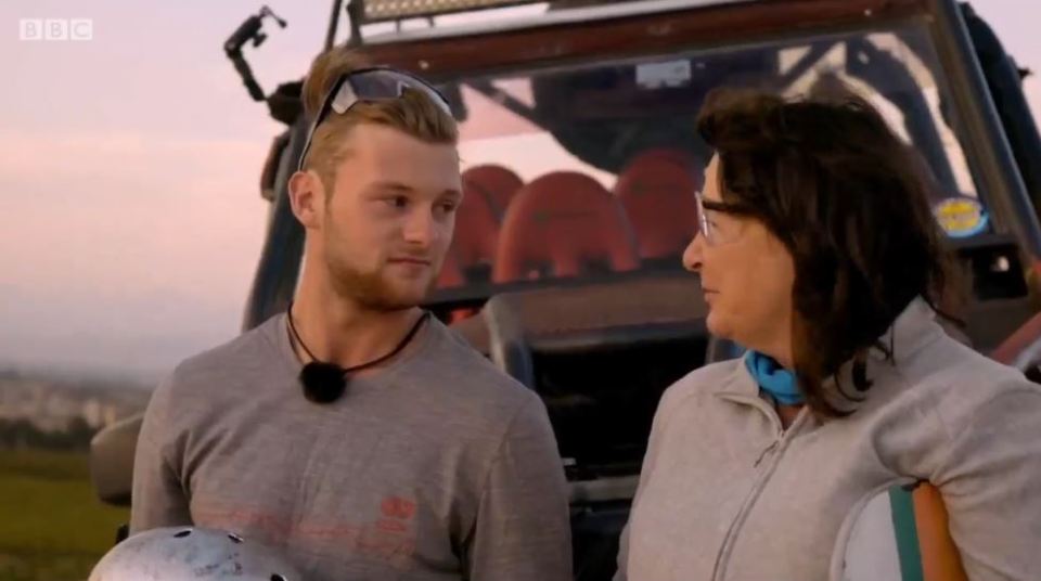A young man and a woman have an emotional conversation.