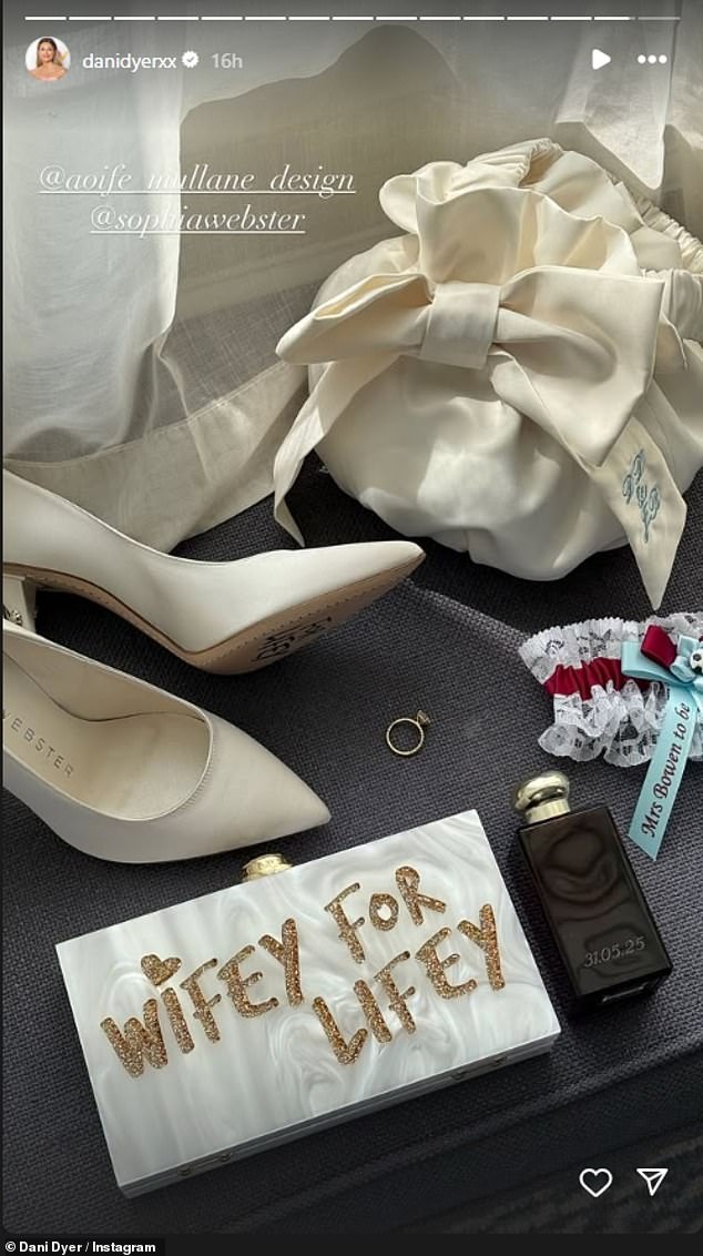 Dani completed her bridal look with a 'wifey for lifey' glitter clutch bag as she showed off her personalised accessories ahead of the ceremony