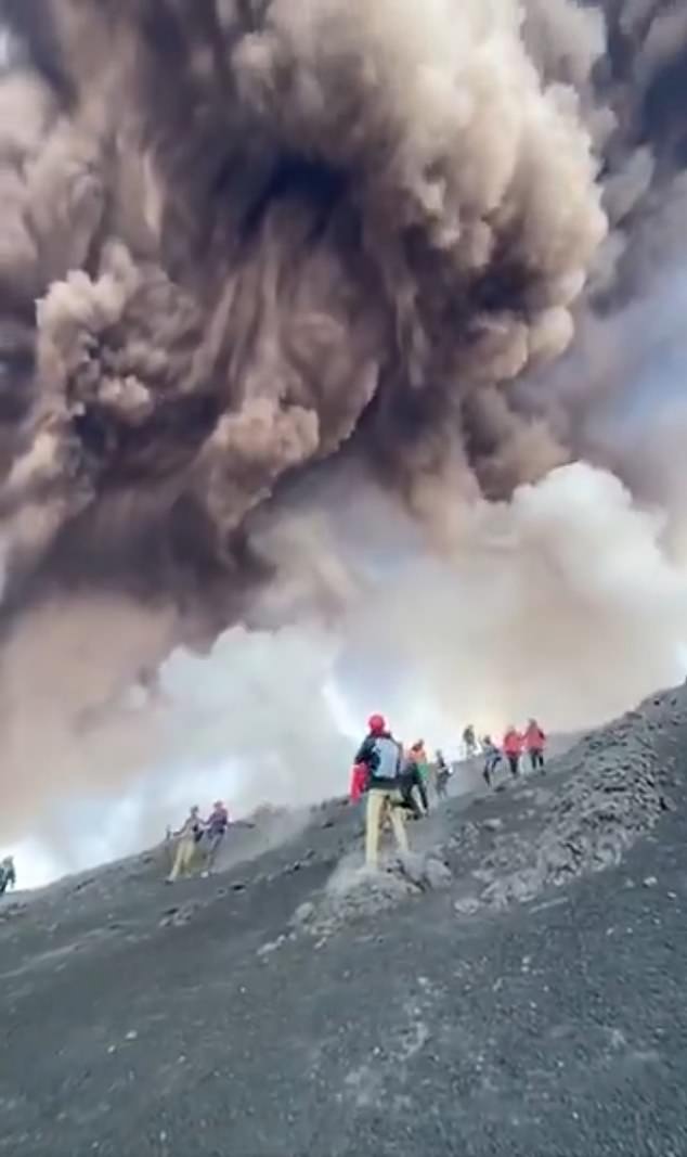 As some dashed down the gravelly slopes, some tourists made enough time to take in the dramatic cloud formation or take photos