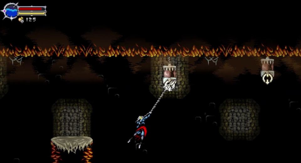 Screenshot of a video game showing a character swinging on a chain in a dark, fiery cavern.