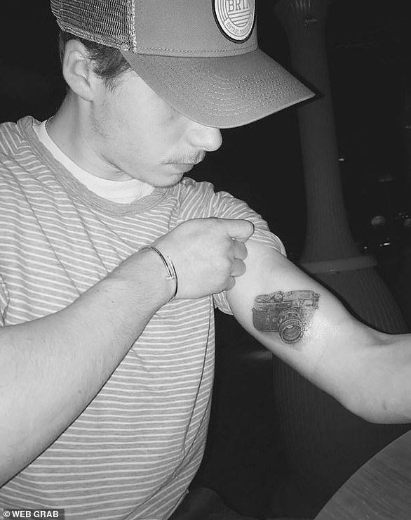 Snap happy: Following his foray into photography, which included the release of a book, Brooklyn had a large camera tattoed on his bicep