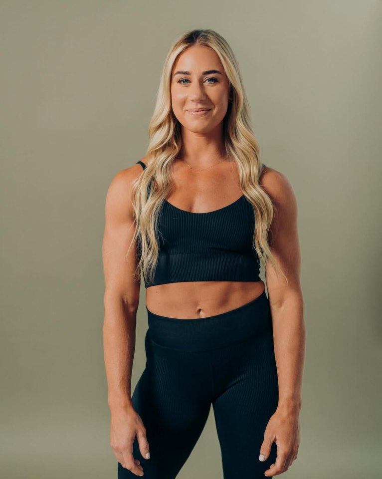 Portrait of a woman in black athletic wear.