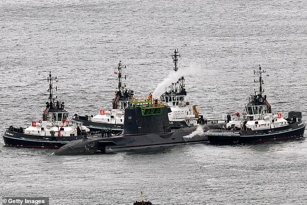 HMS Artful an Astute-class nuclear-powered fleet submarine is manoeuvred in Clyde in March 2025