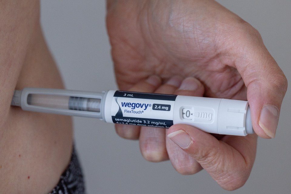 A person injecting Wegovy.