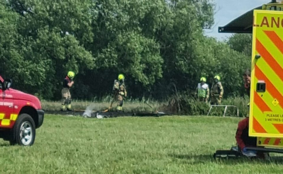 Firefighters extinguishing a boat fire.