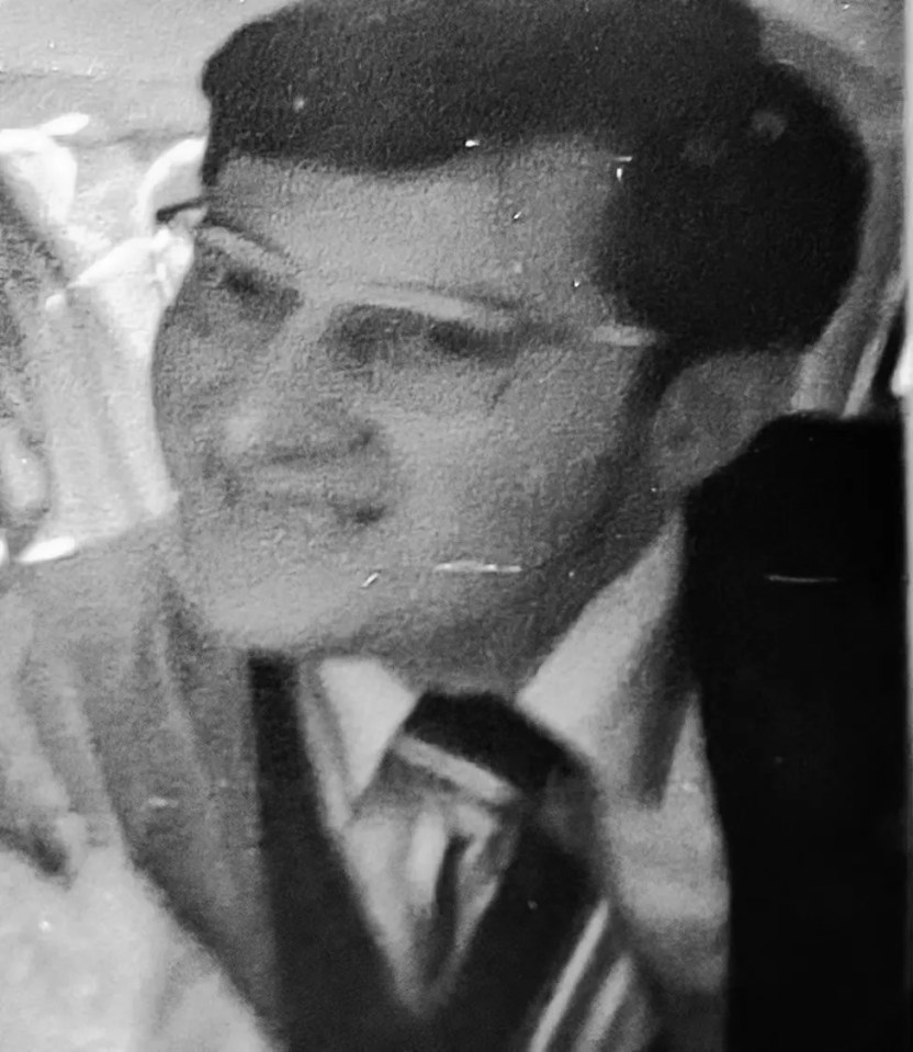 Black and white photo of a teenager in court.