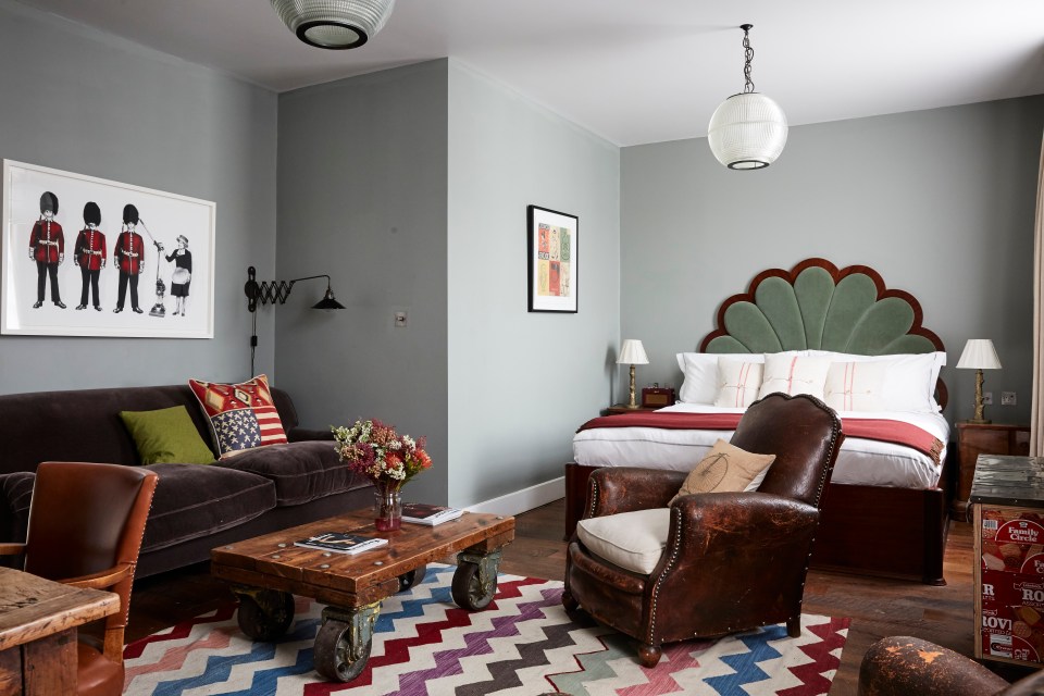 Hotel room with bed and sitting area.
