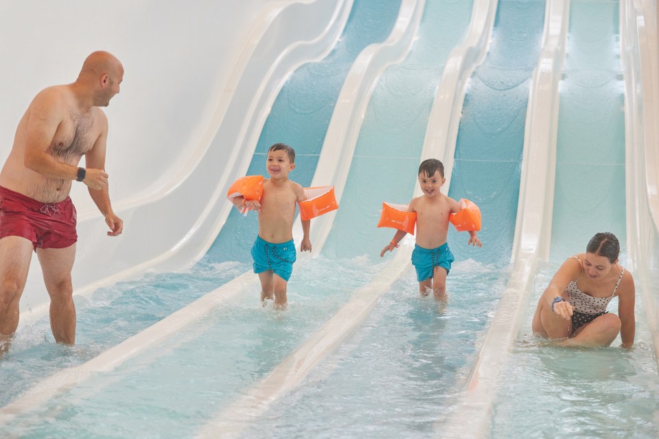 Family enjoying a waterpark slide.