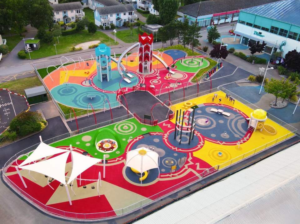 Aerial view of a colorful playground with various play structures.